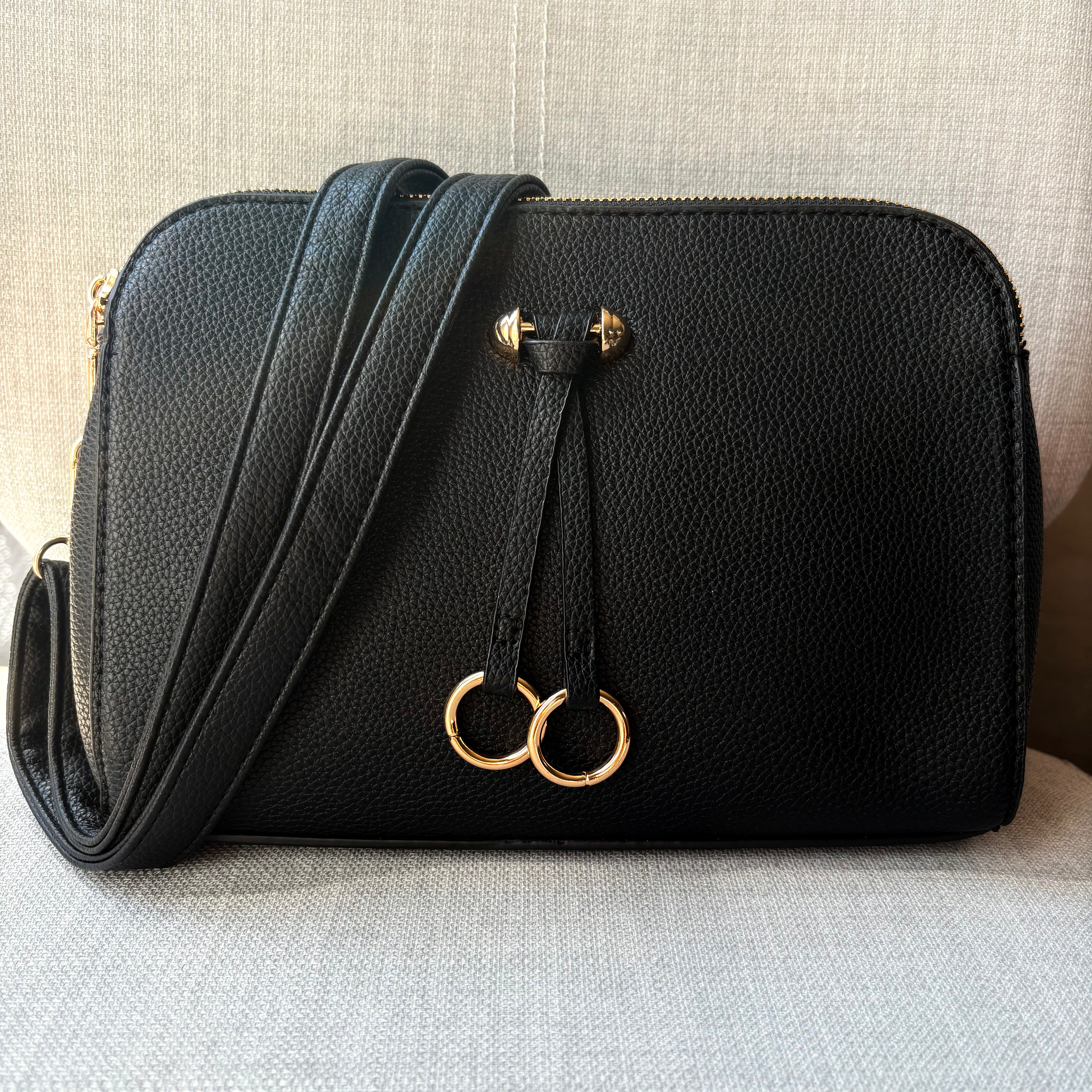 Two ring drop, three pocket crossbody bag - with matching shoulder strap - made from recycled materials