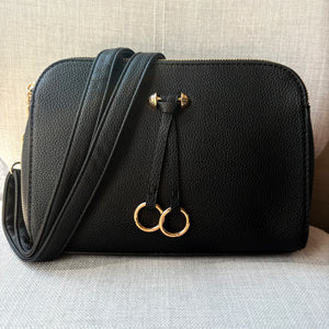 Two ring drop, three pocket crossbody bag - with matching shoulder strap - made from recycled materials