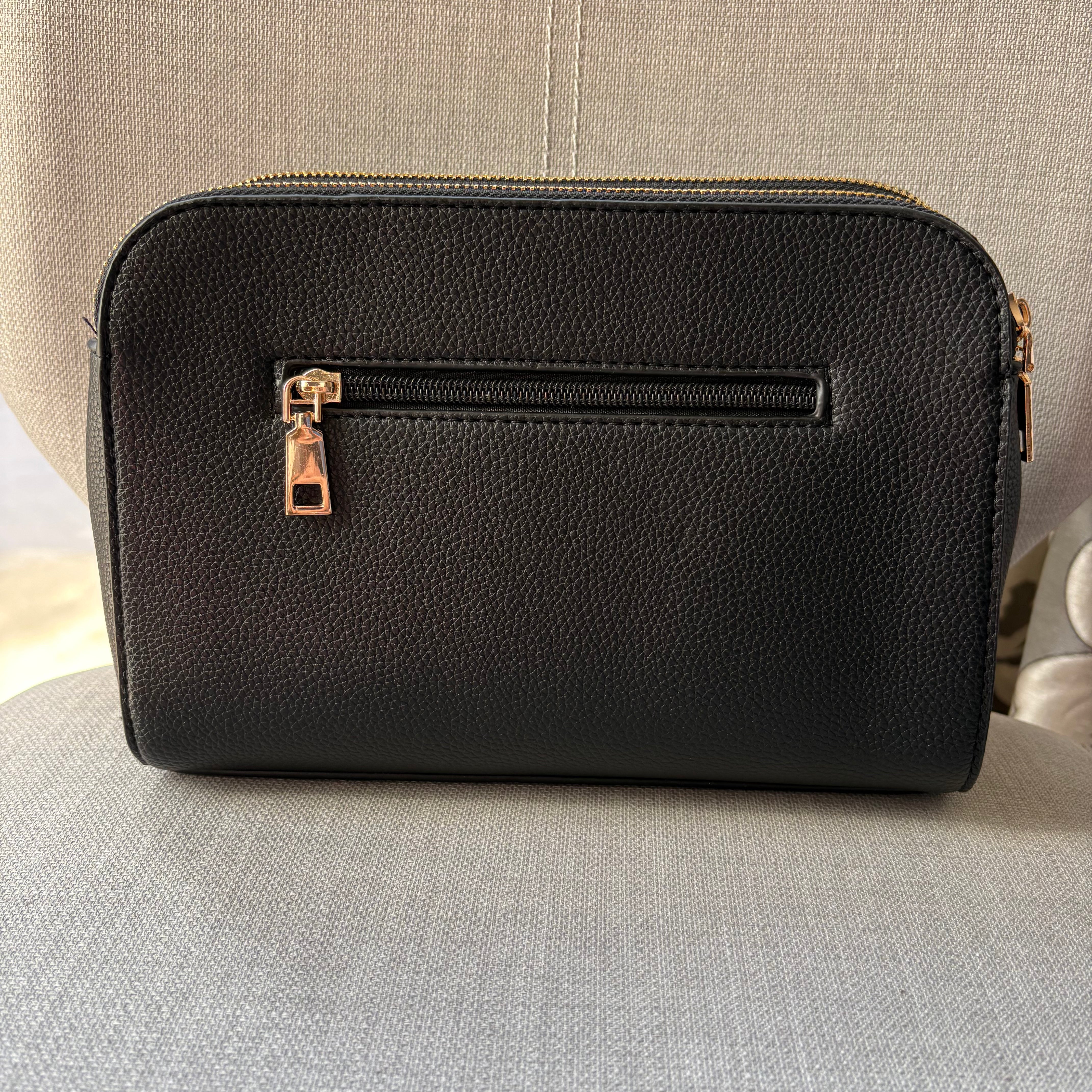 Two ring drop, three pocket crossbody bag - with matching shoulder strap - made from recycled materials