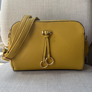 Two ring drop, three pocket crossbody bag - with matching shoulder strap - made from recycled materials