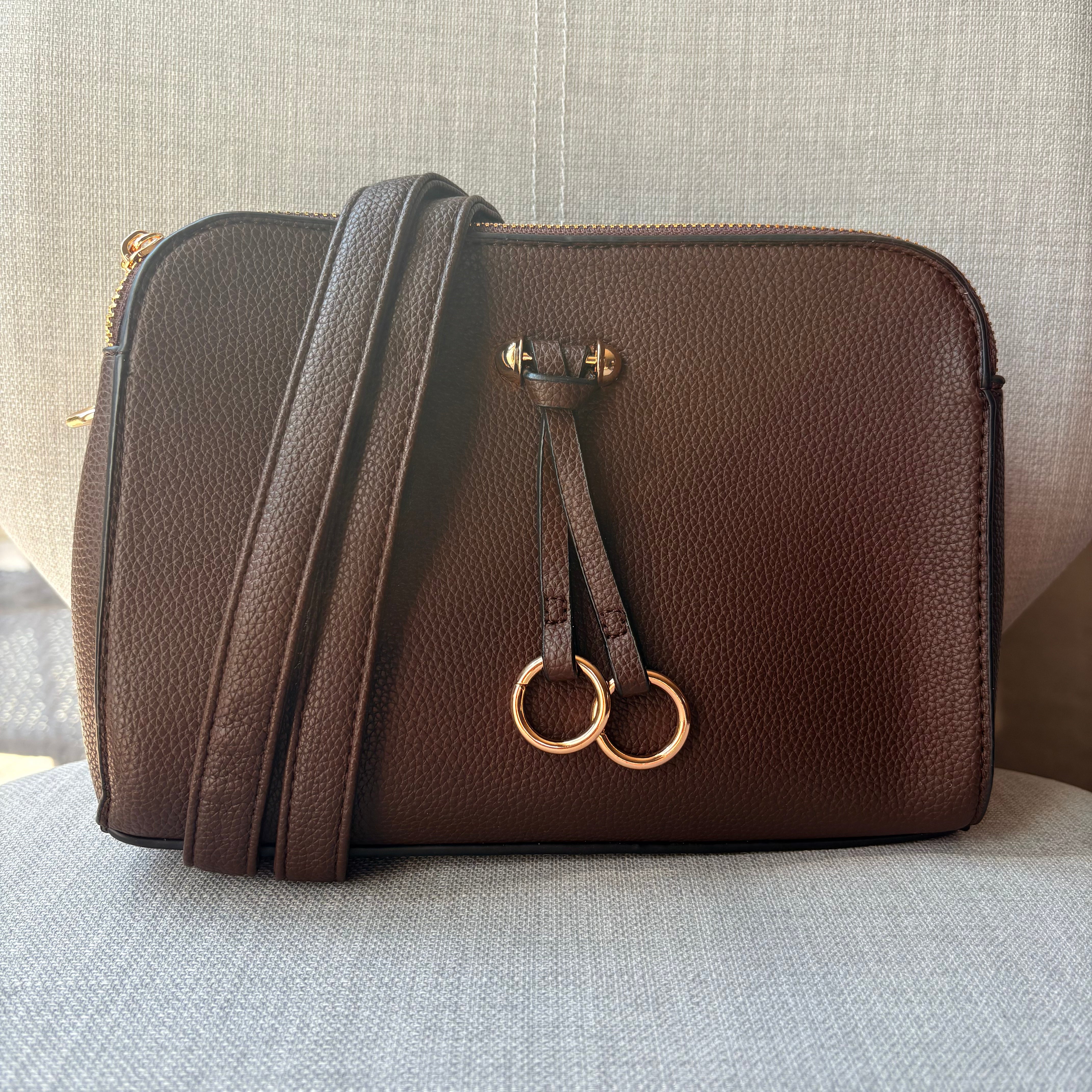 Two ring drop, three pocket crossbody bag - with matching shoulder strap - made from recycled materials