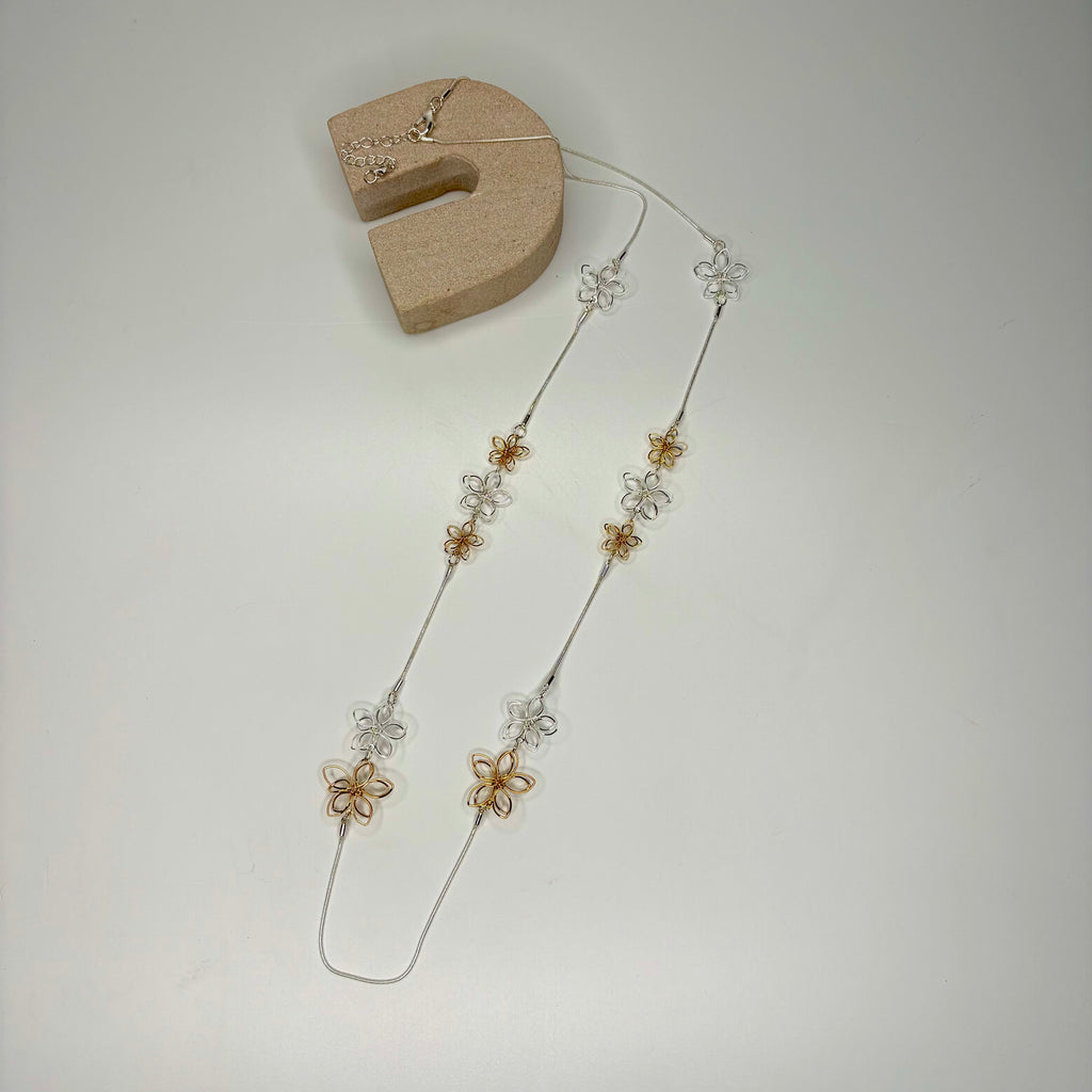 Long necklace, with silver and gold wire flower stations
