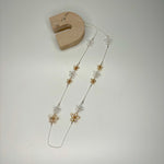 Long necklace, with silver and gold wire flower stations