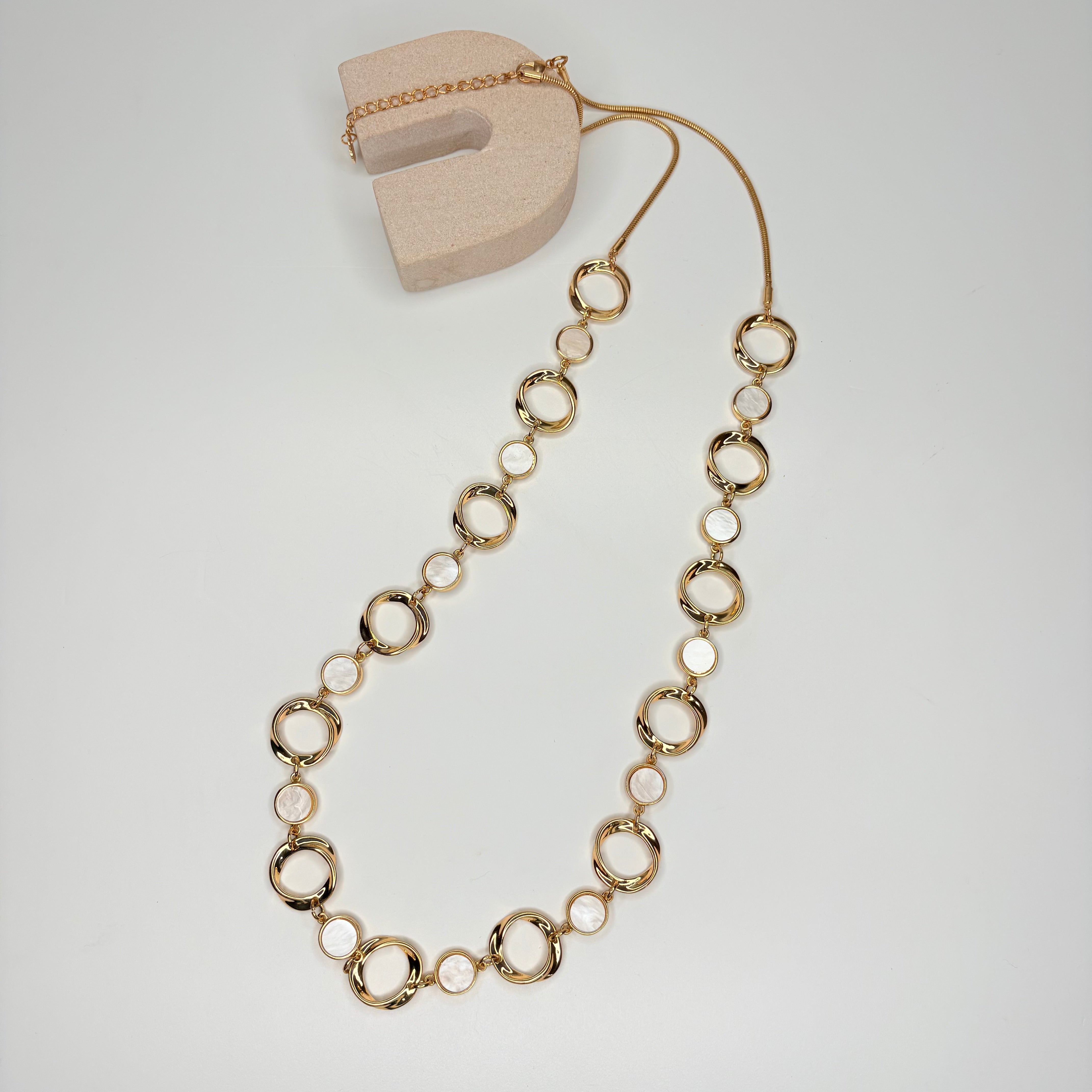 Long gold necklace, with mother of pearl circular stations