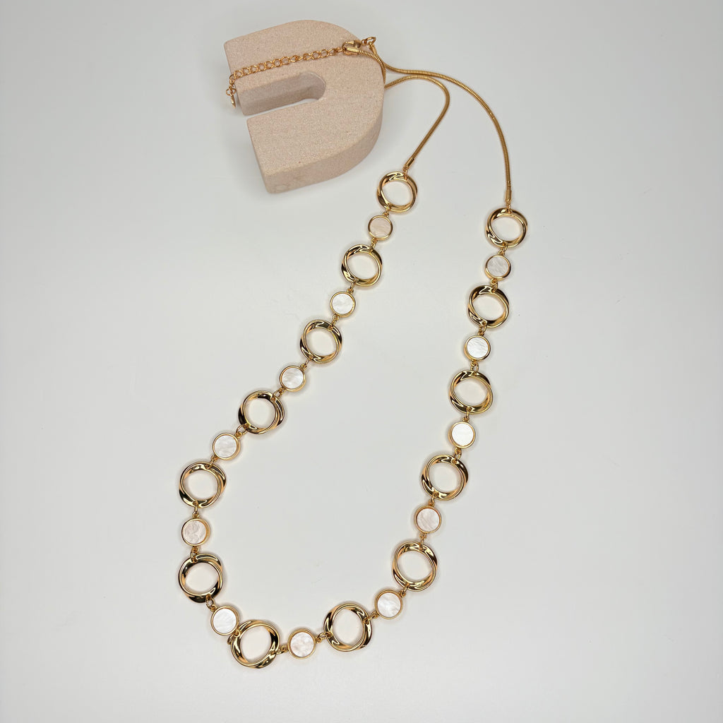 Long gold necklace, with mother of pearl circular stations