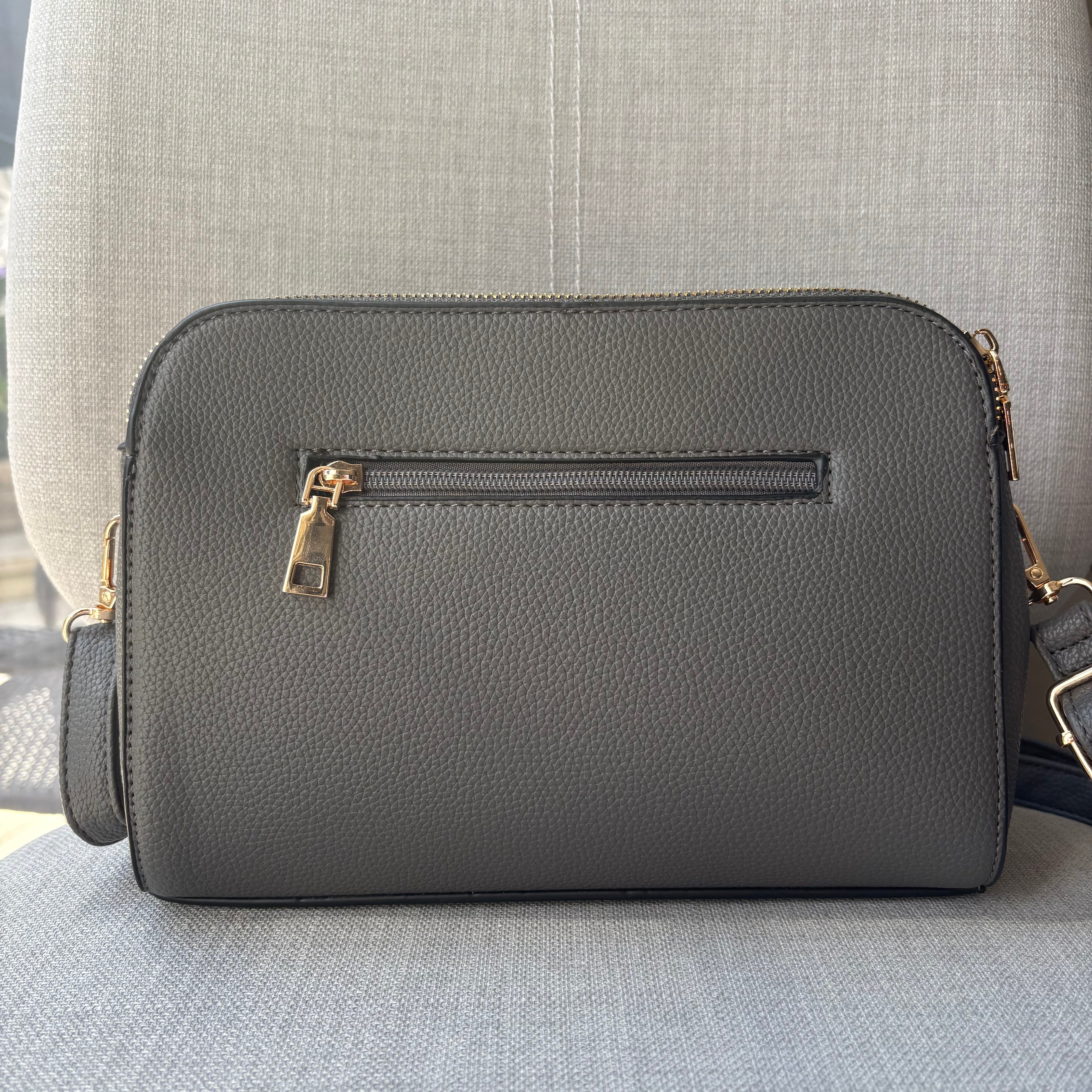 Two ring drop, three pocket crossbody bag - with matching shoulder strap - made from recycled materials