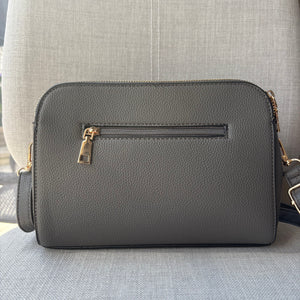 Two ring drop, three pocket crossbody bag - with matching shoulder strap - made from recycled materials