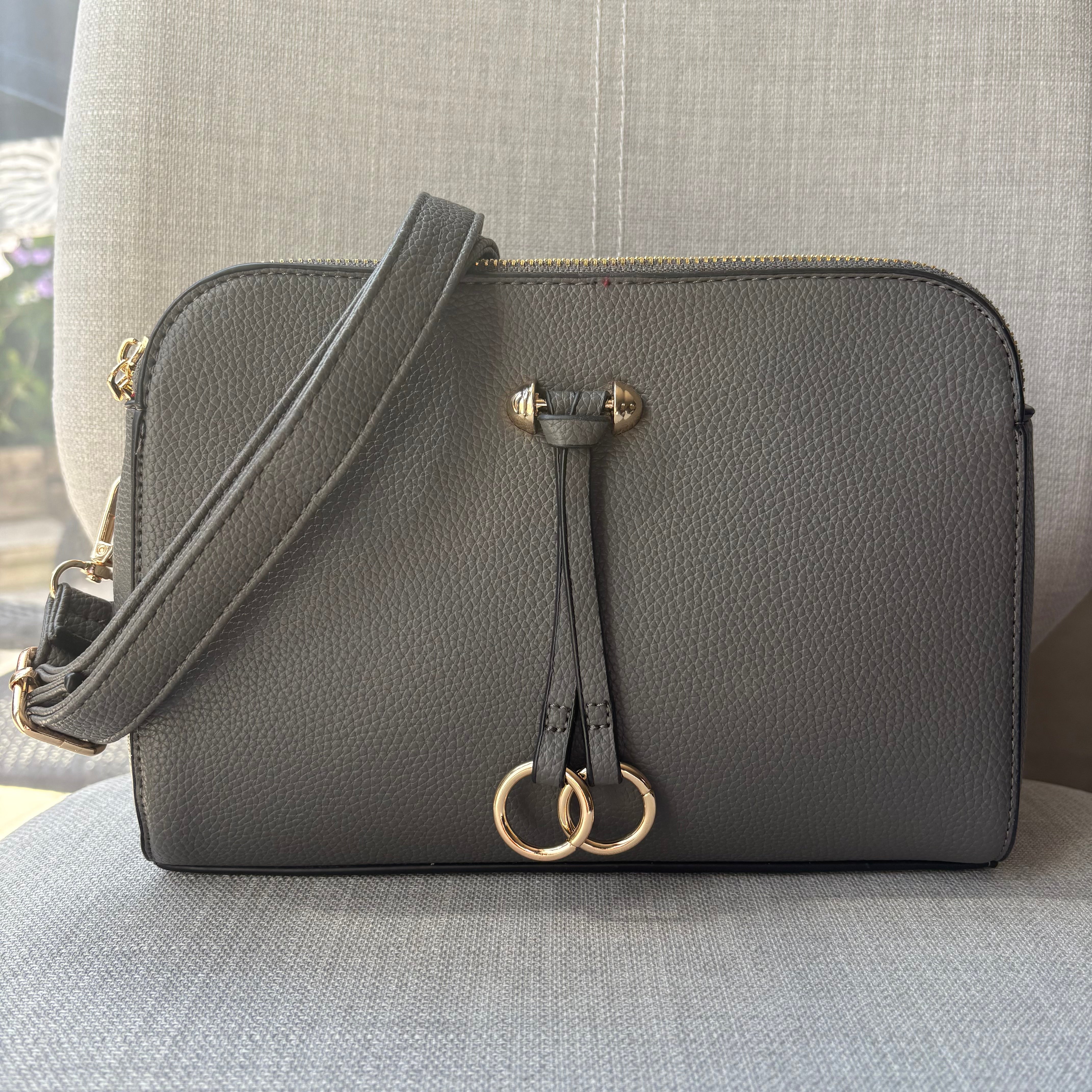 Two ring drop, three pocket crossbody bag - with matching shoulder strap - made from recycled materials
