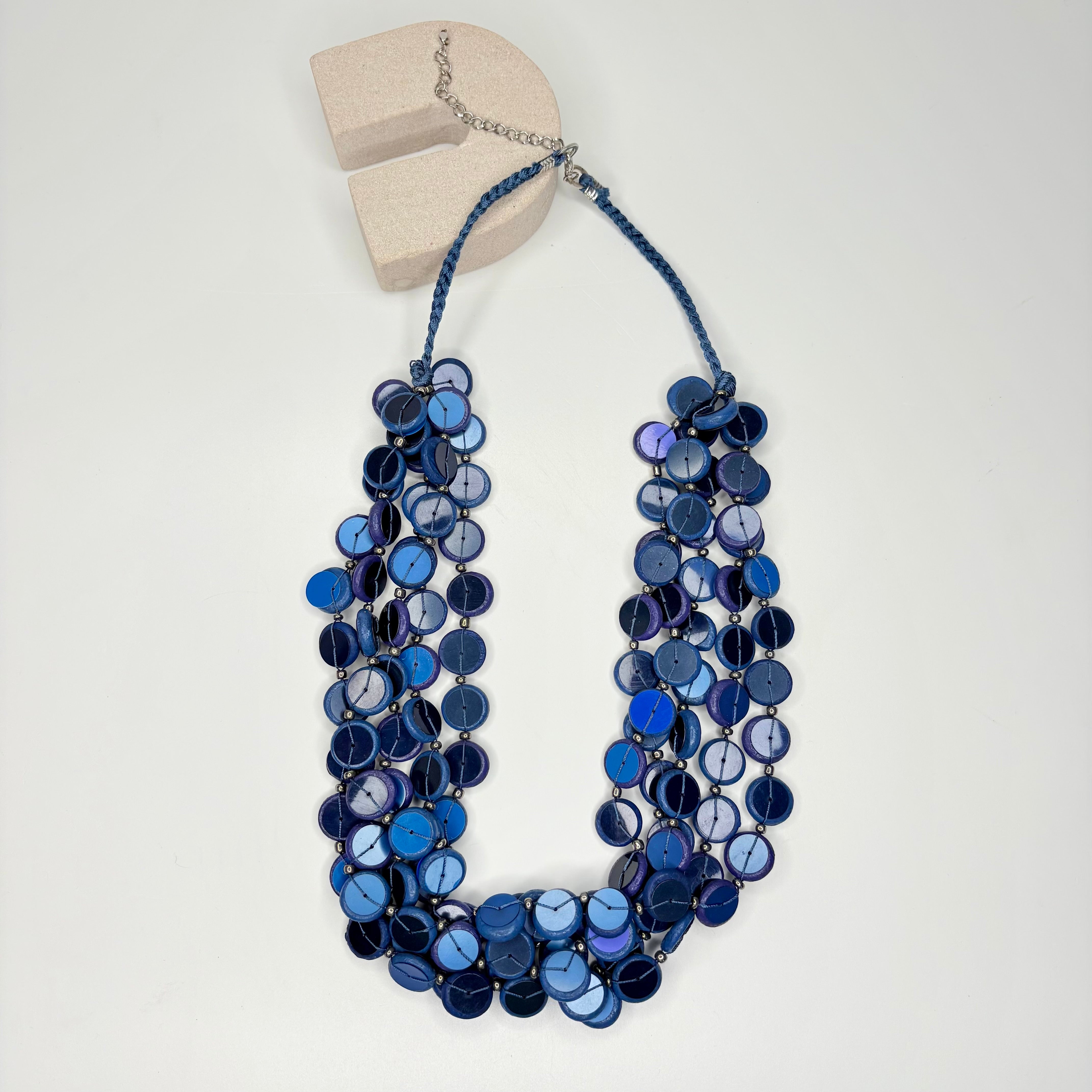 Short navy blue necklace, with multi-row blue circular stations