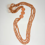 Long mahogany brown necklace, with multi-row wooden links