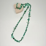 Long necklace, with tinted green natural shell stations
