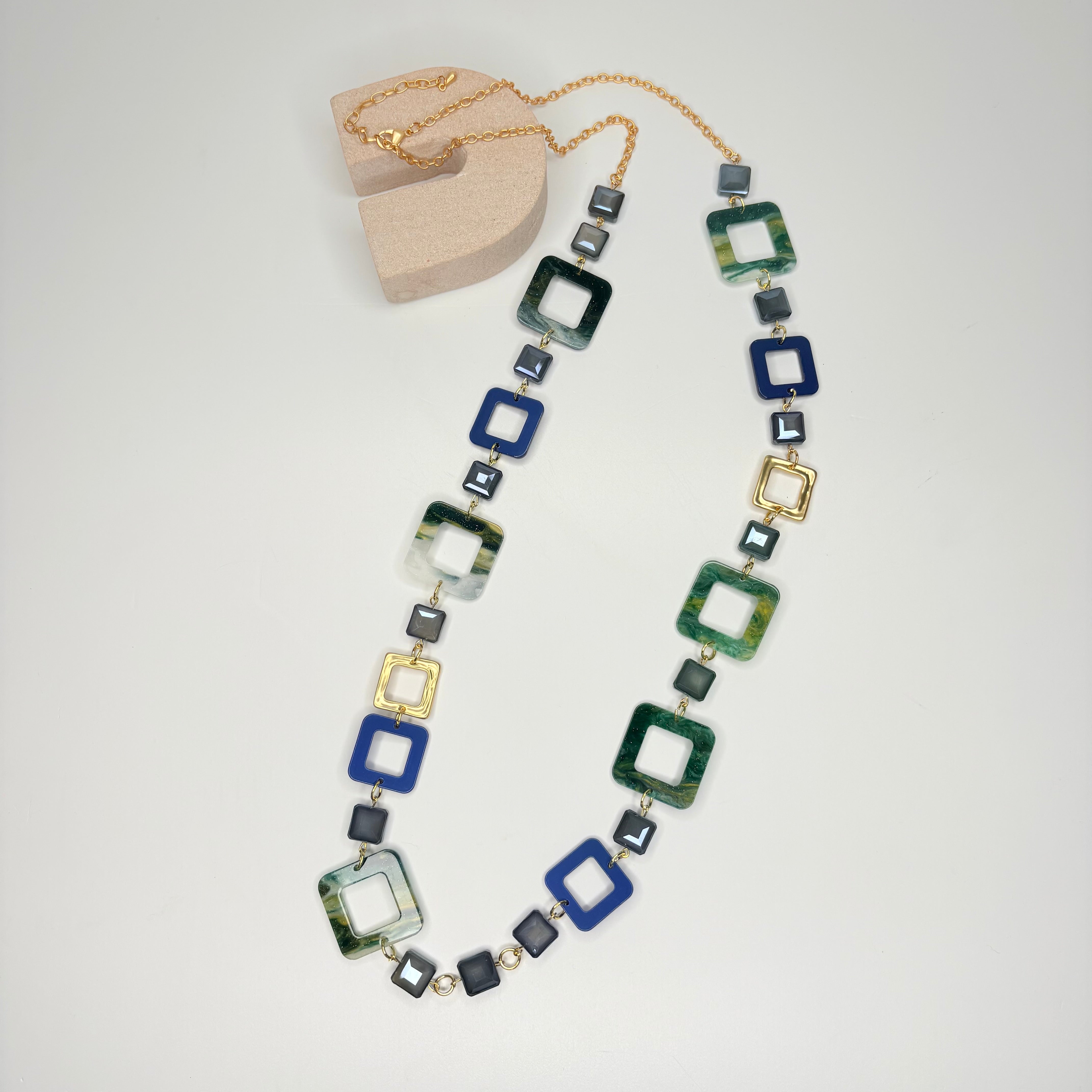 Long gold necklace, with green and blue interlinked square stations
