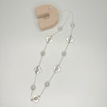 Long silver necklace, with faux pearl and daisy stations