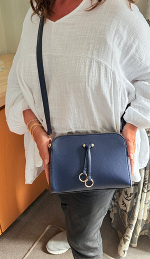 Two ring drop, three pocket crossbody bag - with matching shoulder strap - made from recycled materials