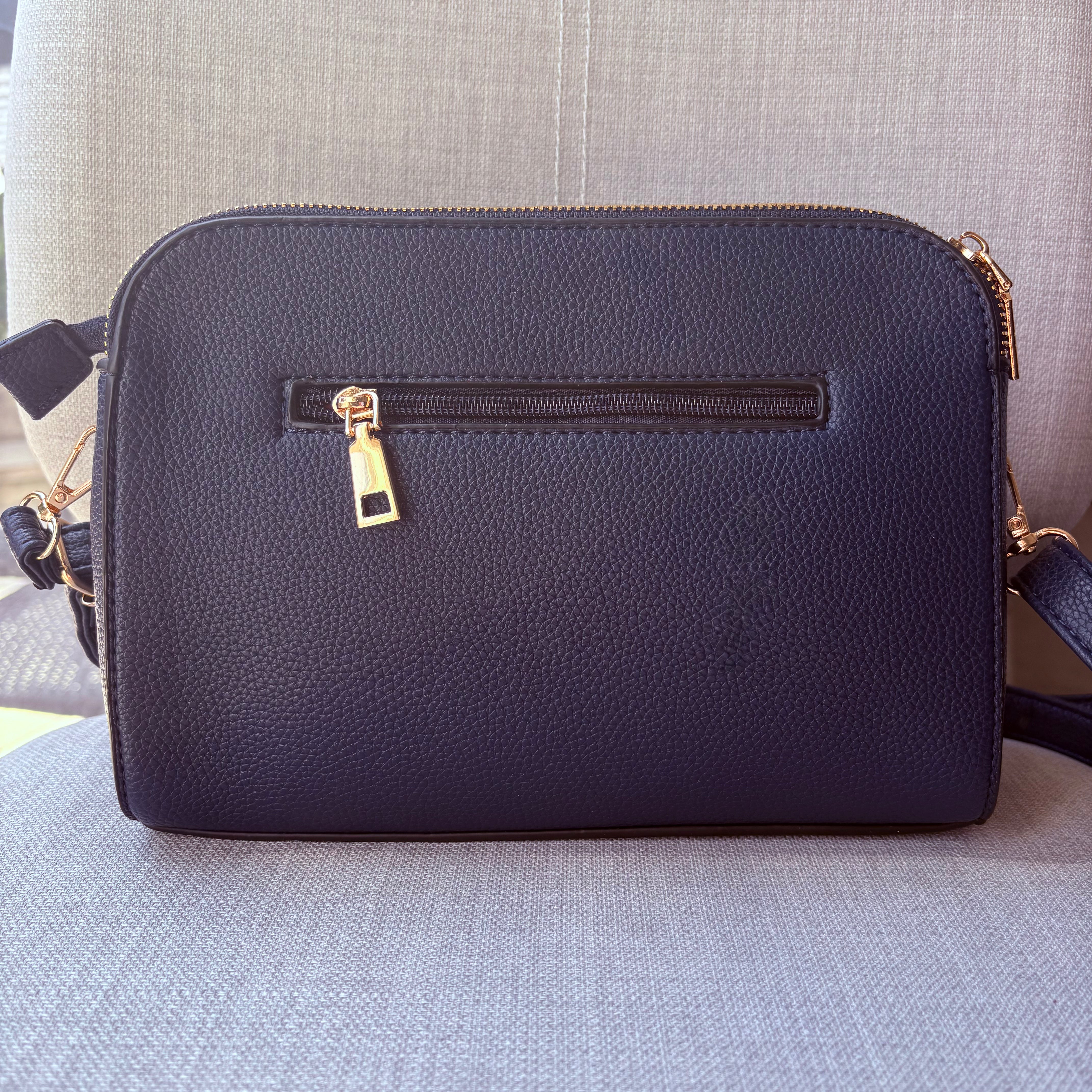 Two ring drop, three pocket crossbody bag - with matching shoulder strap - made from recycled materials