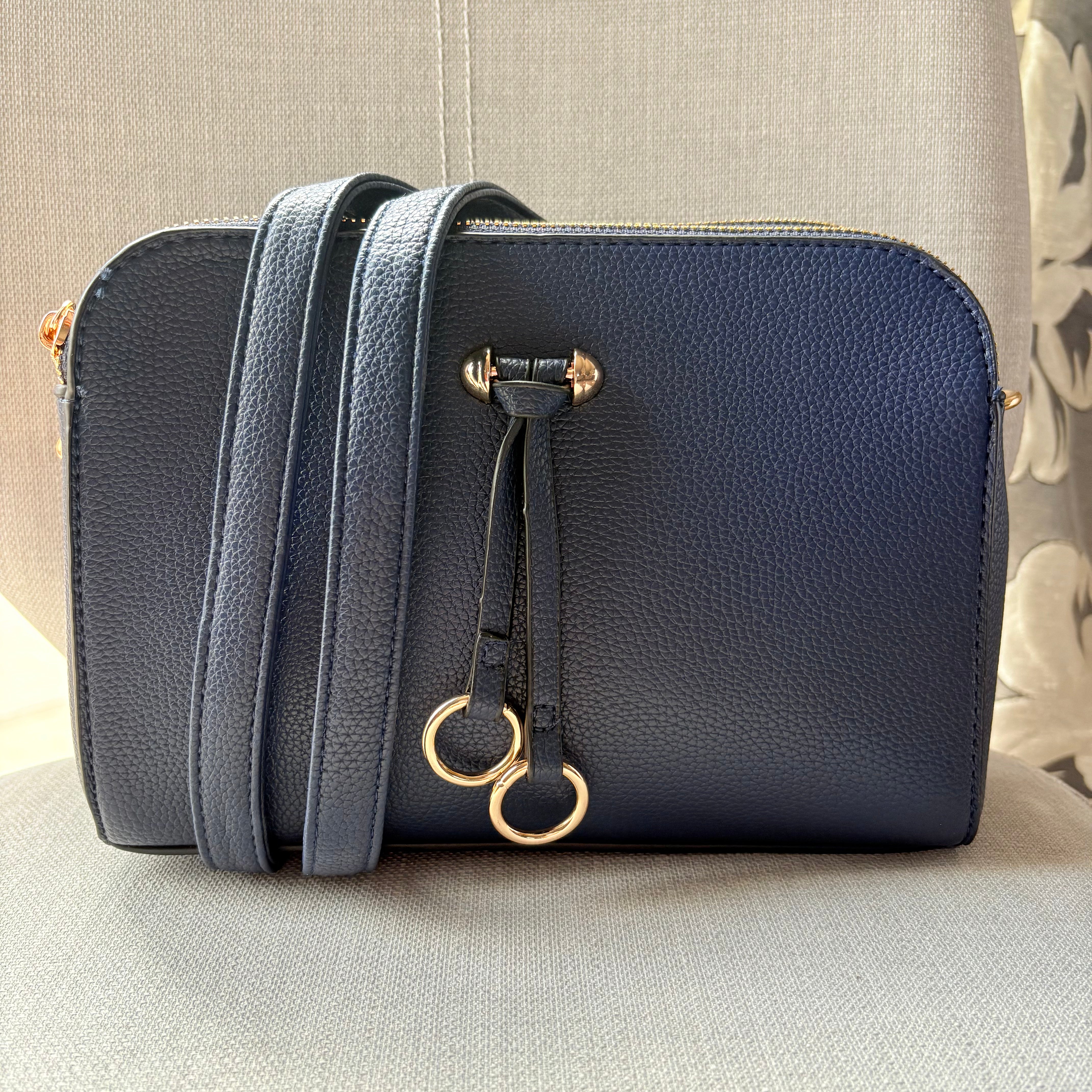 Two ring drop, three pocket crossbody bag - with matching shoulder strap - made from recycled materials