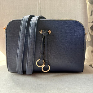 Two ring drop, three pocket crossbody bag - with matching shoulder strap - made from recycled materials
