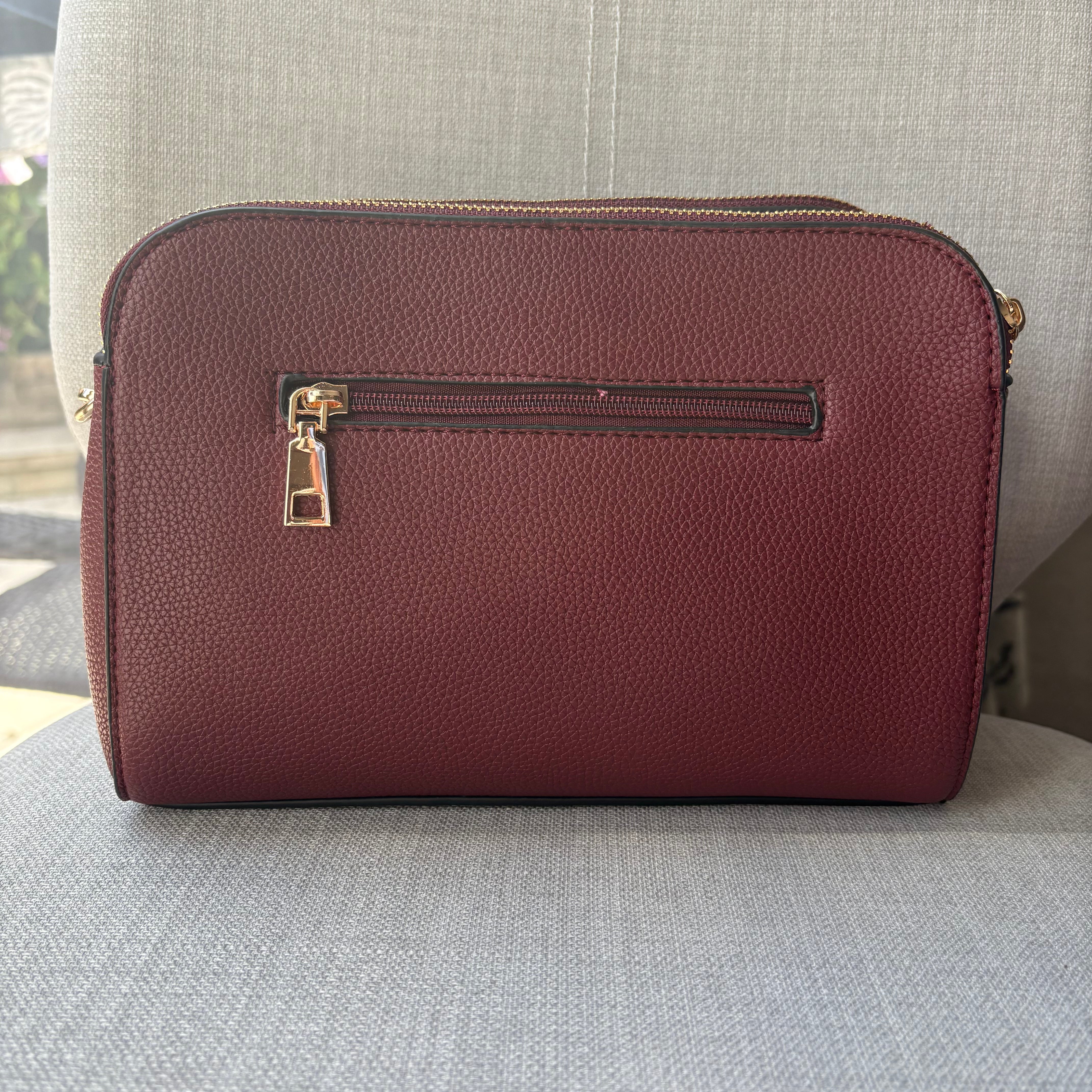 Two ring drop, three pocket crossbody bag - with matching shoulder strap - made from recycled materials