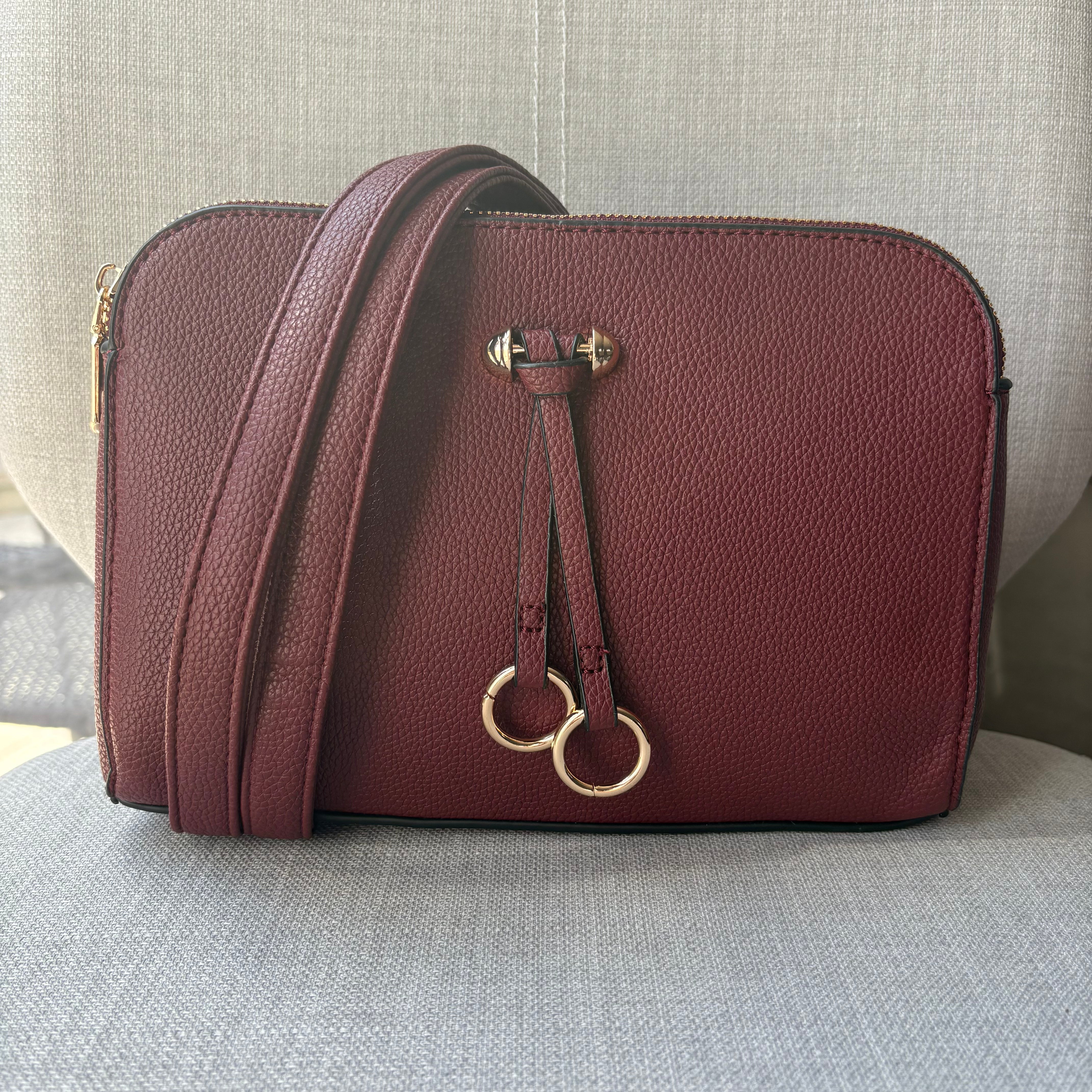 Two ring drop, three pocket crossbody bag - with matching shoulder strap - made from recycled materials