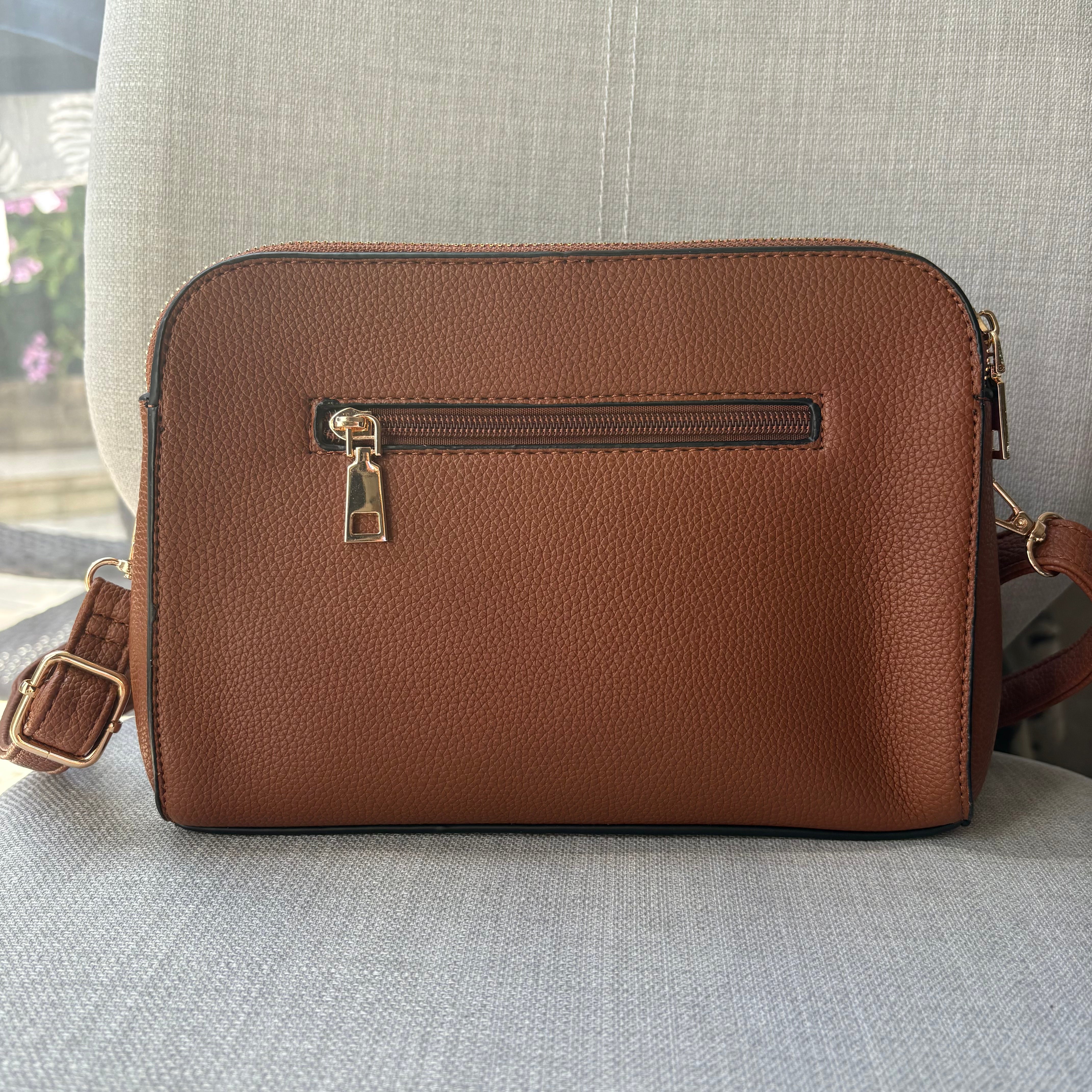 Two ring drop, three pocket crossbody bag - with matching shoulder strap - made from recycled materials