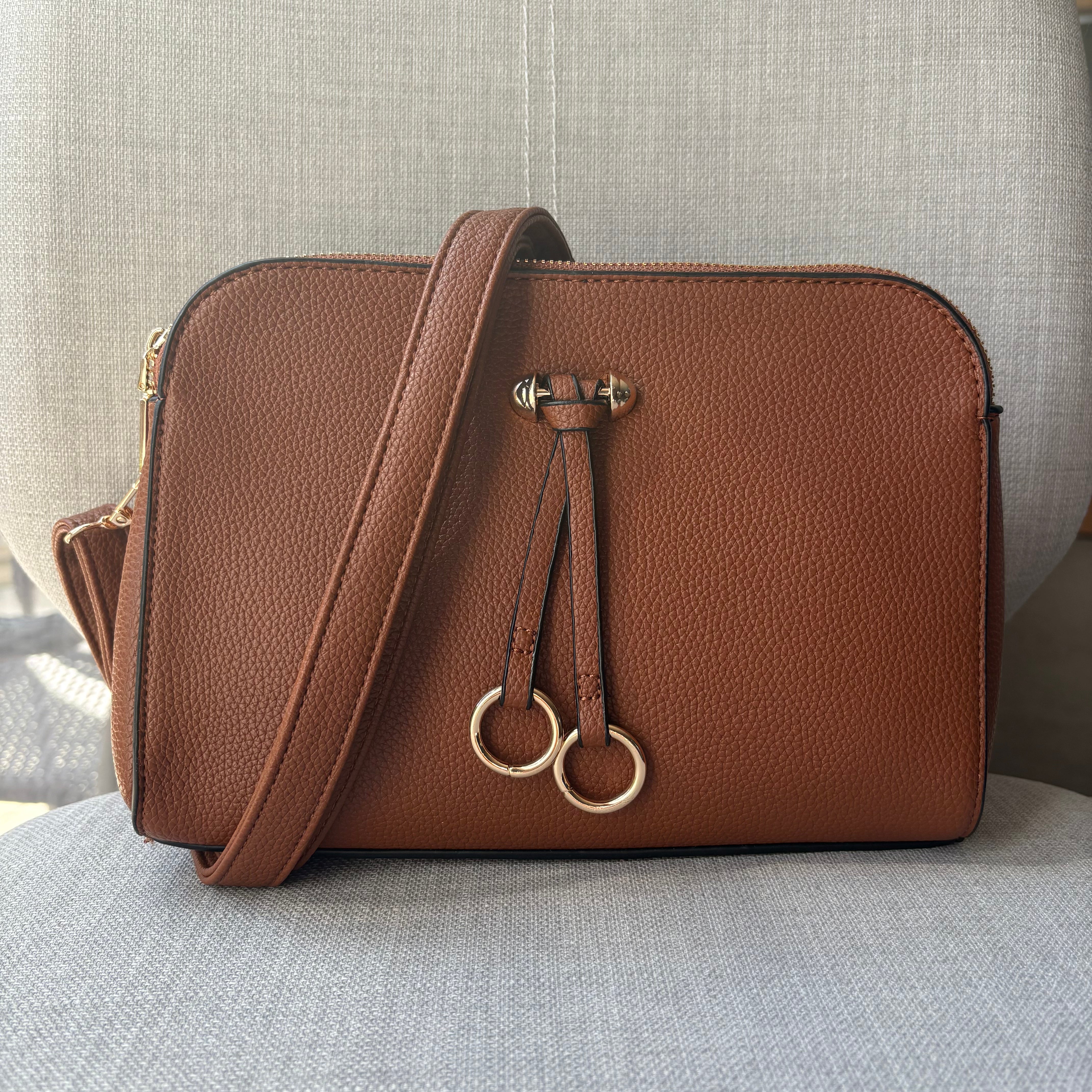 Two ring drop, three pocket crossbody bag - with matching shoulder strap - made from recycled materials