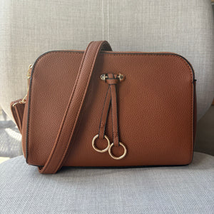 Two ring drop, three pocket crossbody bag - with matching shoulder strap - made from recycled materials