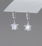 Silver & shiny crystal star drop earrings