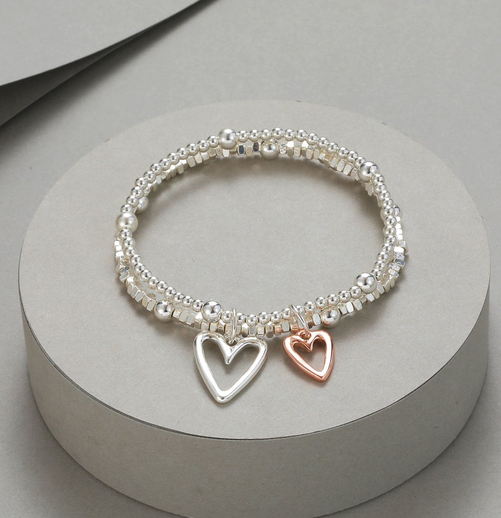 Elasticated bracelet in silver & gold, with two-row heart pendant
