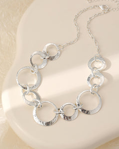 Short necklace, with silver battered metal circular links