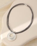 Short silver magnetic necklace, with matte circular pendant