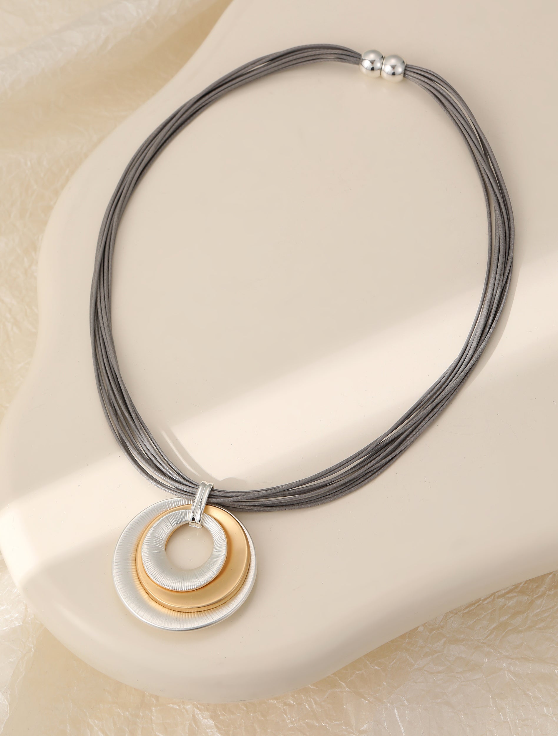 Short silver & gold magnetic necklace, with matte circular pendant