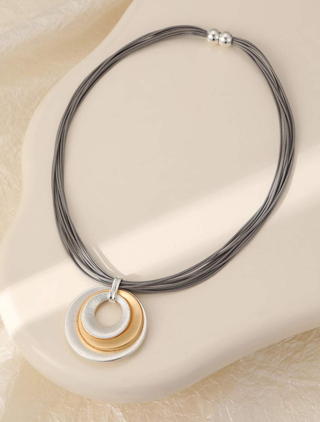 Short silver & gold magnetic necklace, with matte circular pendant