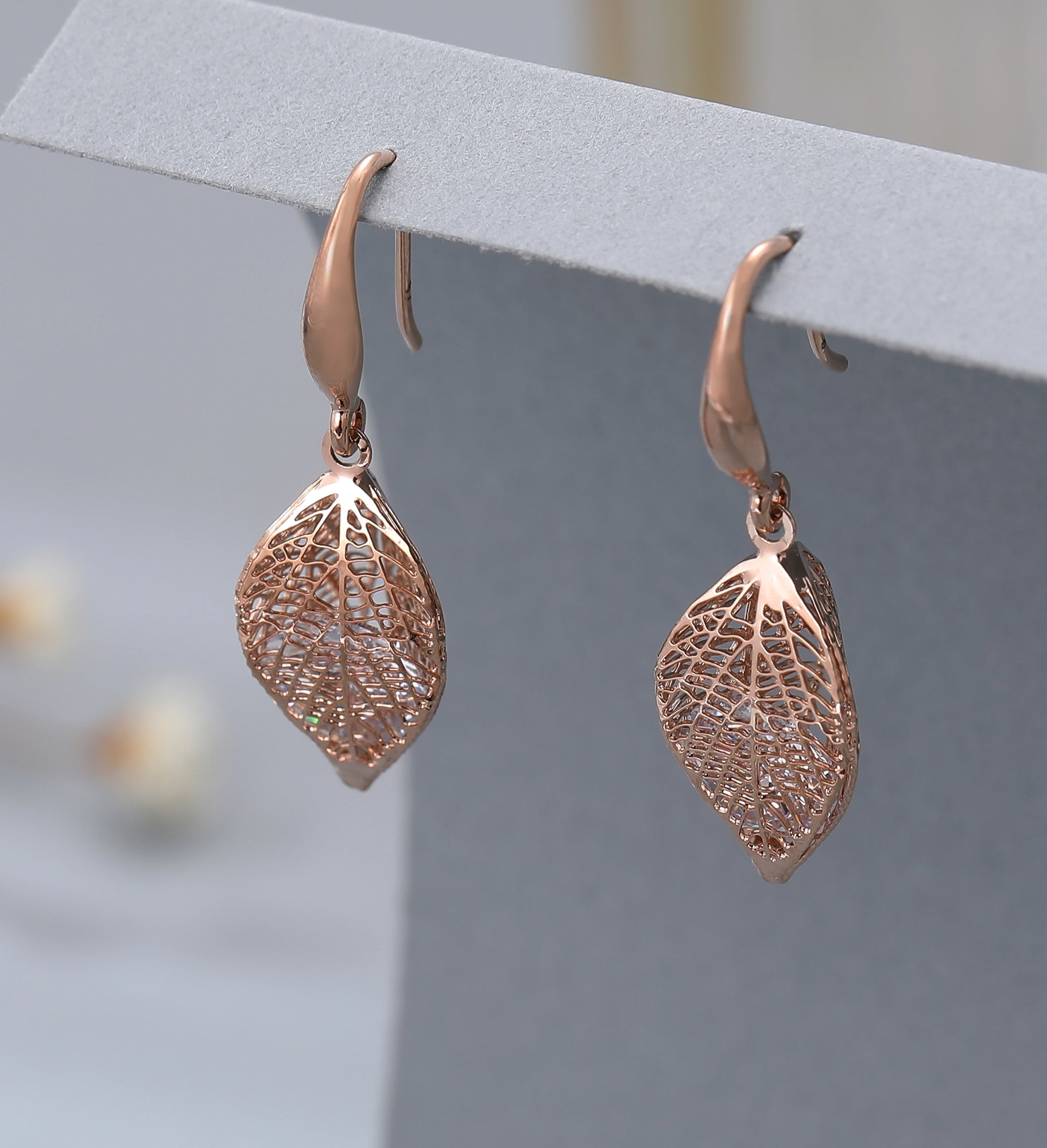 Rose gold caged crystal leaf earrings
