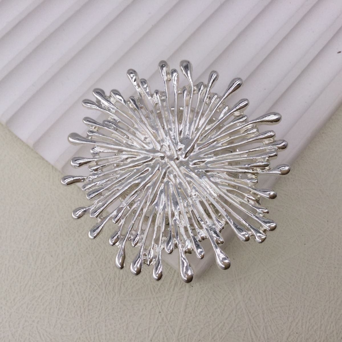 Silver starburst magnetic brooch and scarf clip