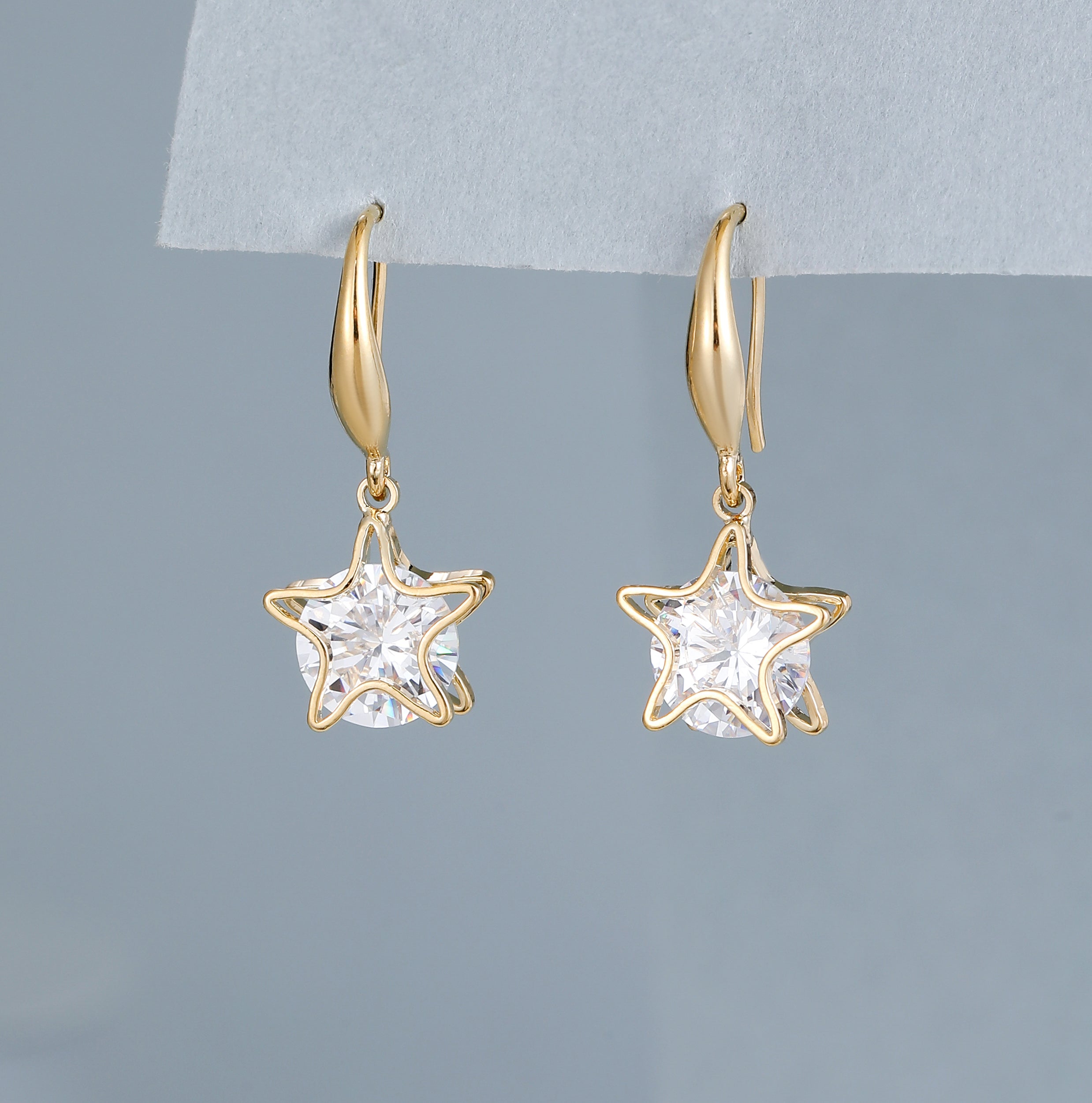 Gold & shiny crystal star drop earrings