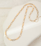 Long gold necklace, with rectangular stations