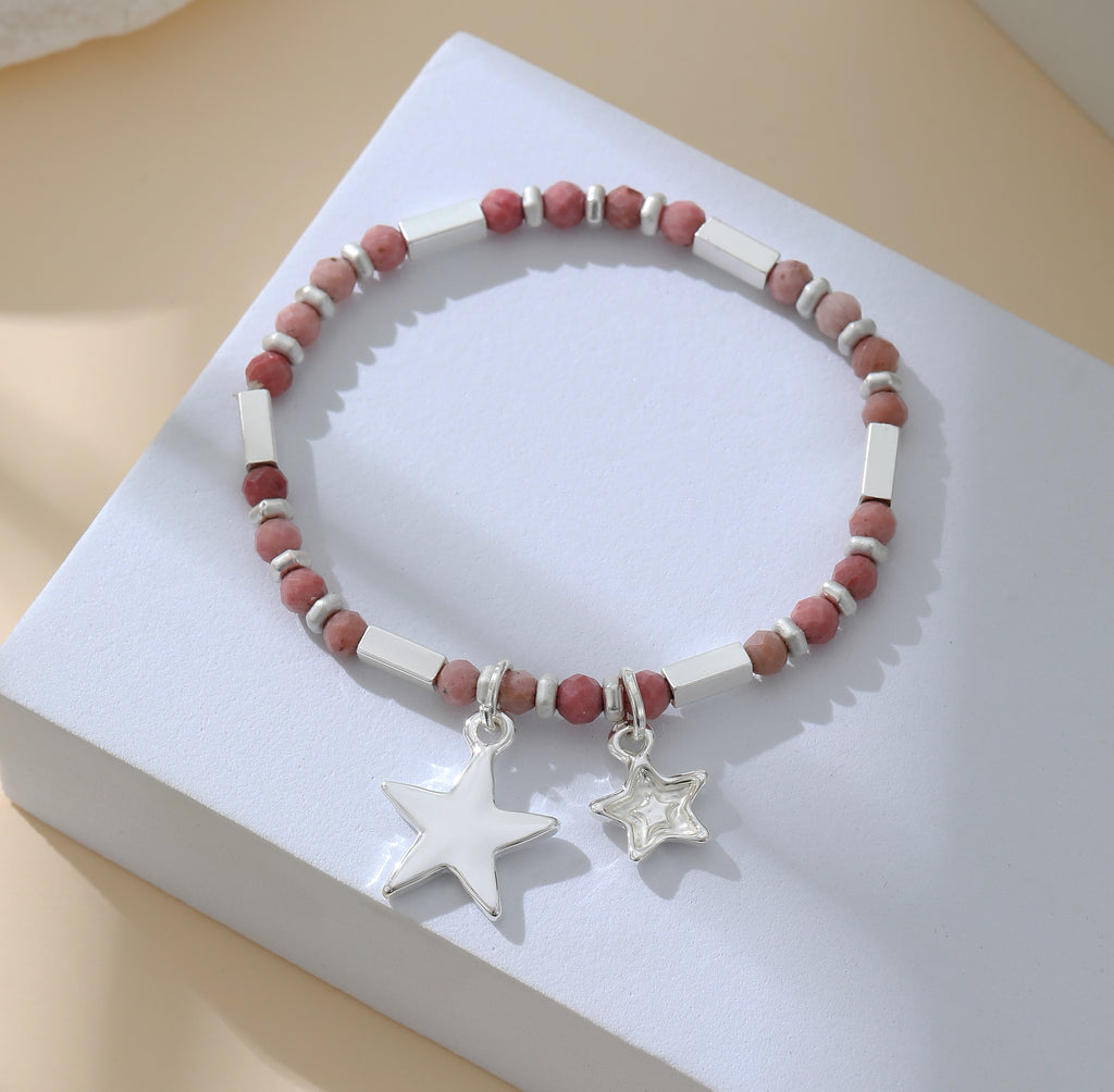 Elasticated bracelet in silver, with pink beads and star pendant