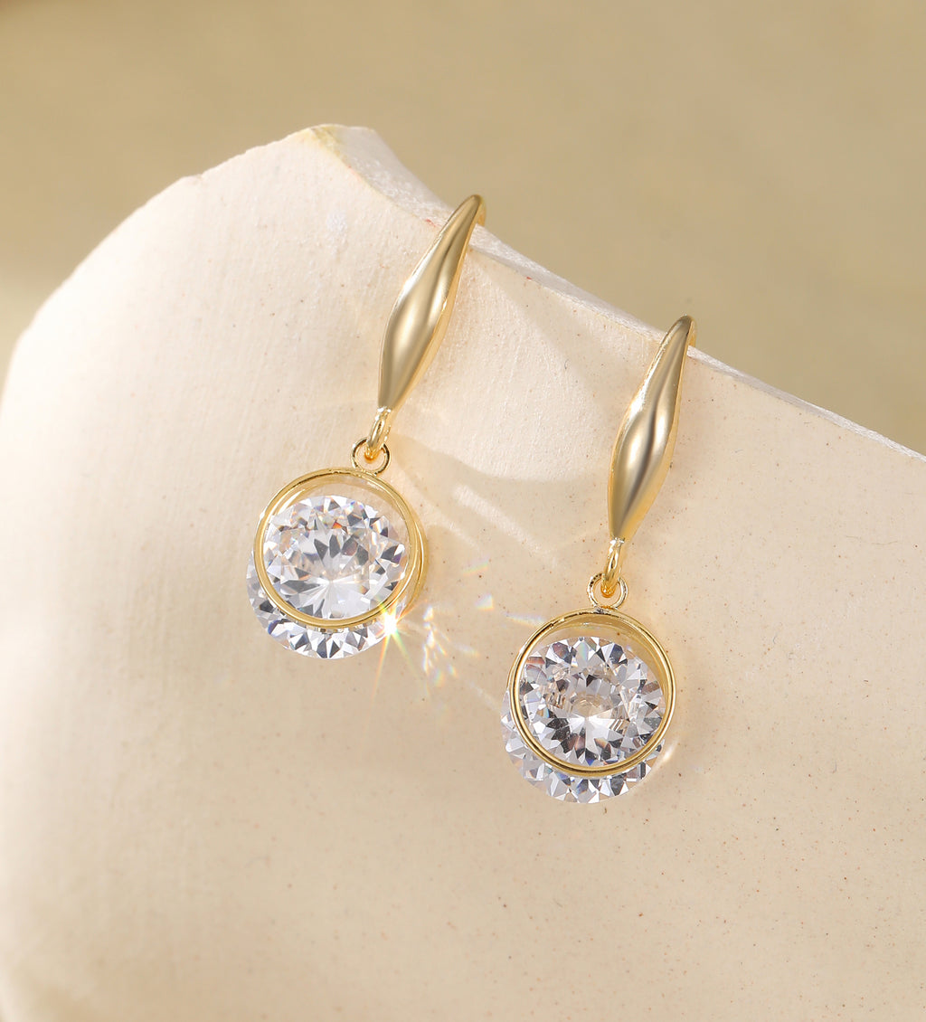 Gold and shiny crystal drop earrings