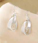 Silver knot design drop earrings