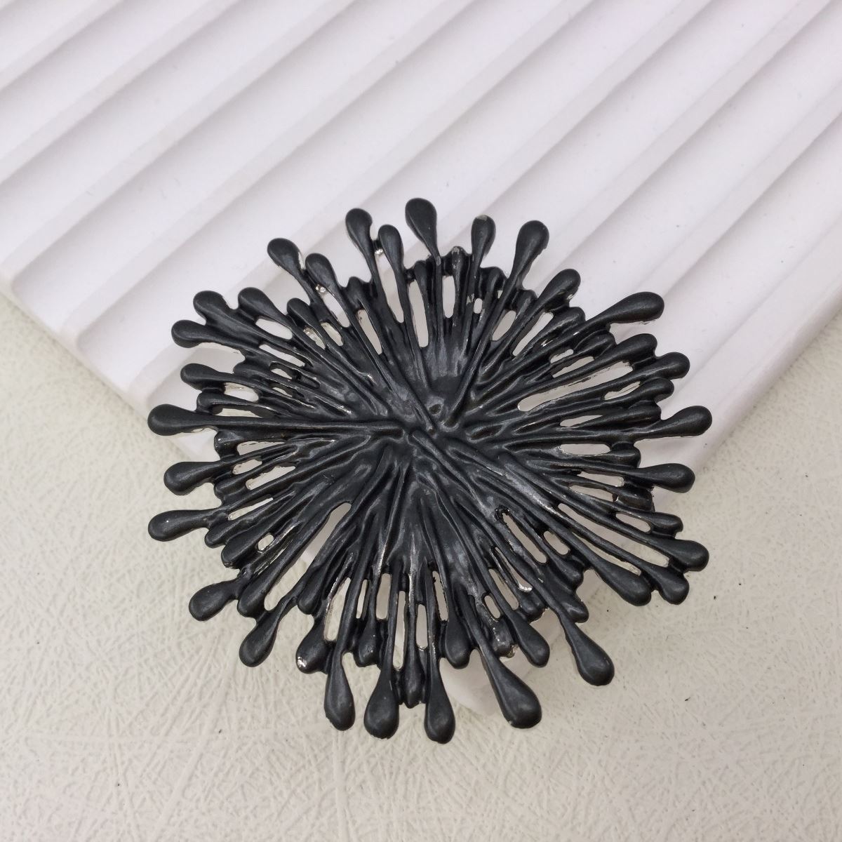 Dark grey starburst magnetic brooch and scarf clip
