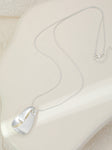Long silver necklace, with knot design pendant
