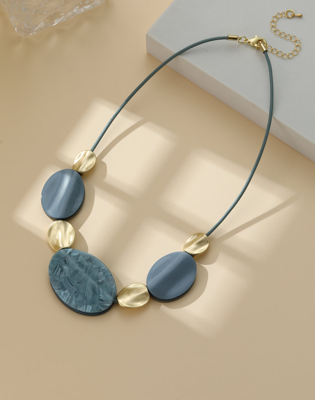 Short necklace, with gold & blue shaded circular stations