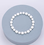 Elasticated bracelet in silver with square stations
