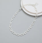 Short t-bar fastener necklace in silver, with rectangular stations