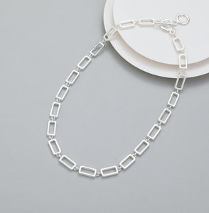 Short t-bar fastener necklace in silver, with rectangular stations