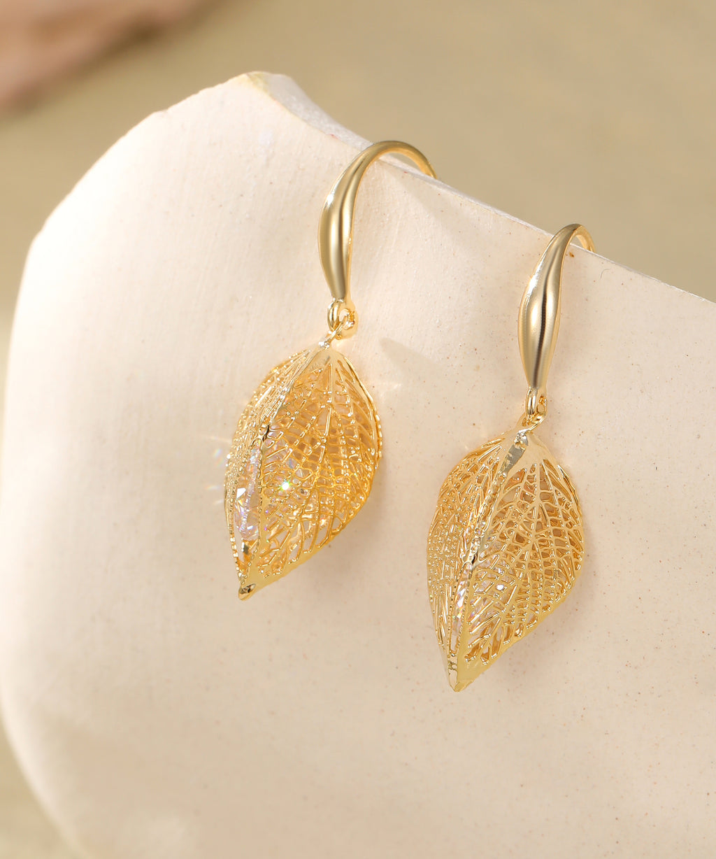 Gold caged crystal leaf earrings