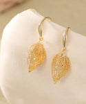 Gold caged crystal leaf earrings