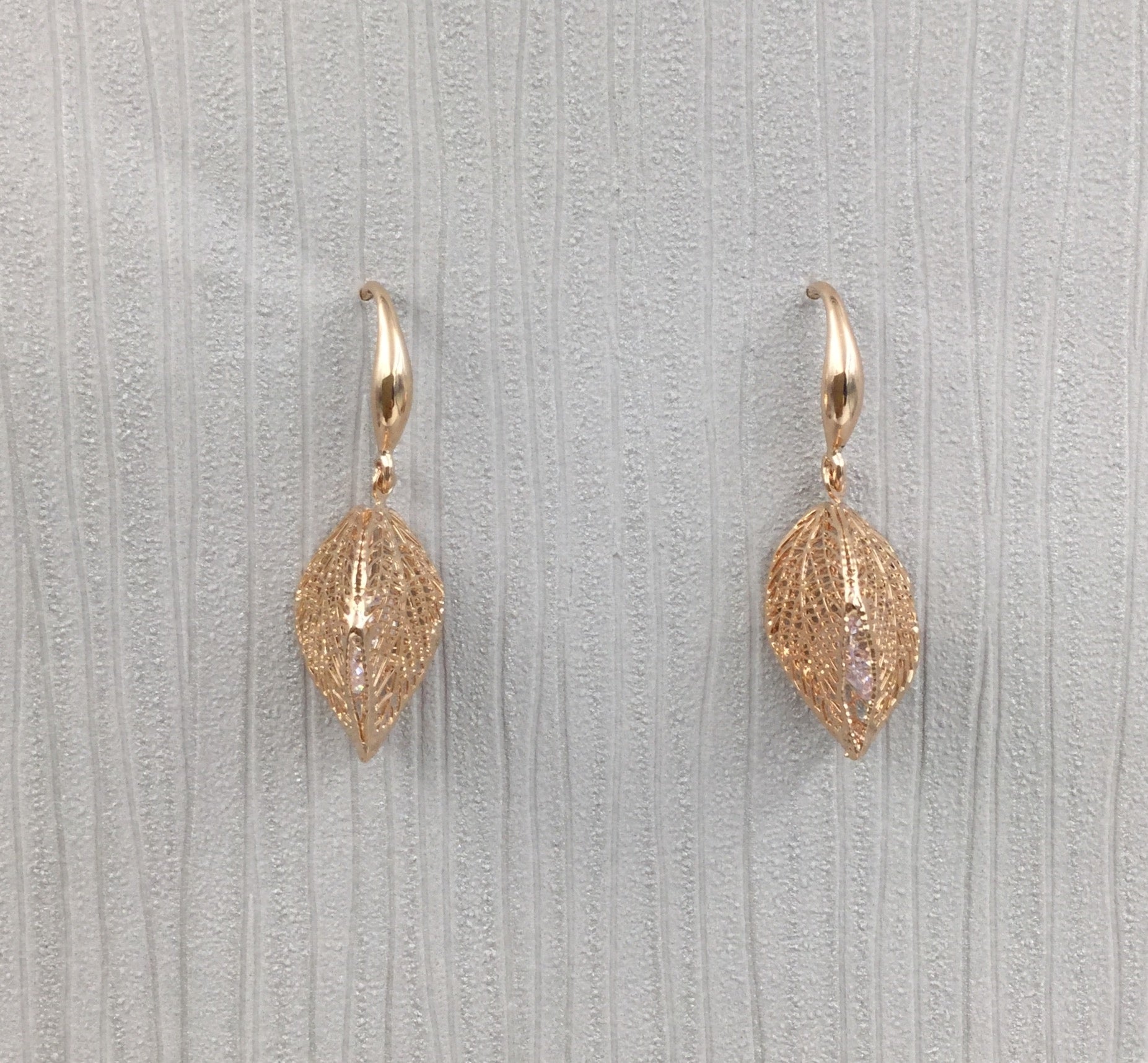 Rose gold caged crystal leaf earrings