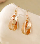 Gold knot design drop earrings